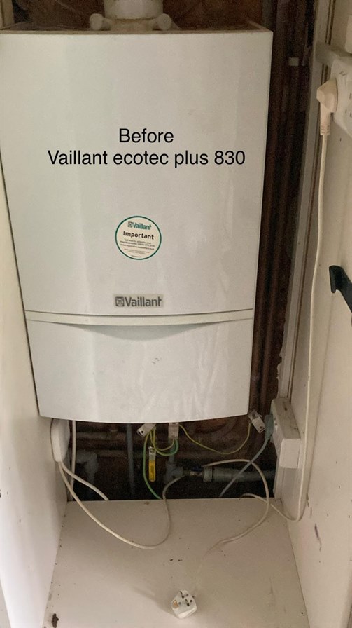 Boiler cupboard and existing connections after removal of Vaillant 830