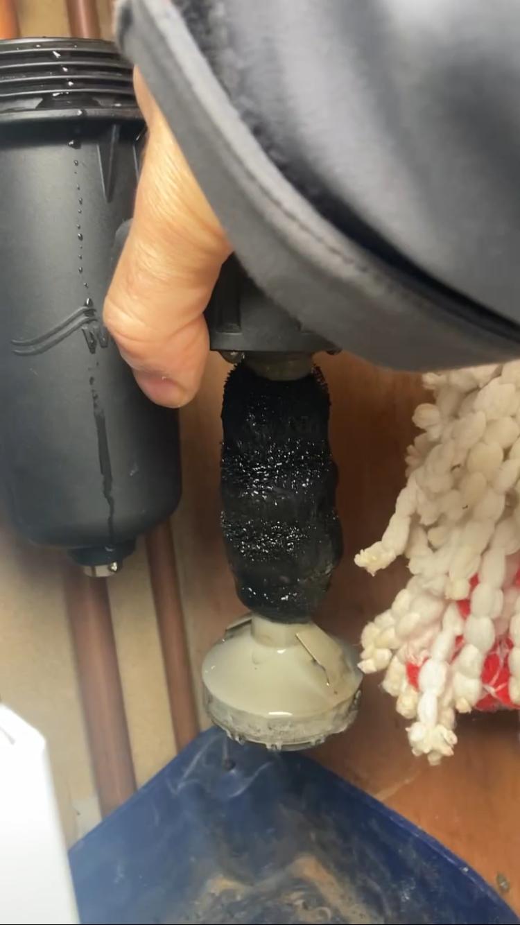 Magnetic boiler system filter covered with captured heating sludge