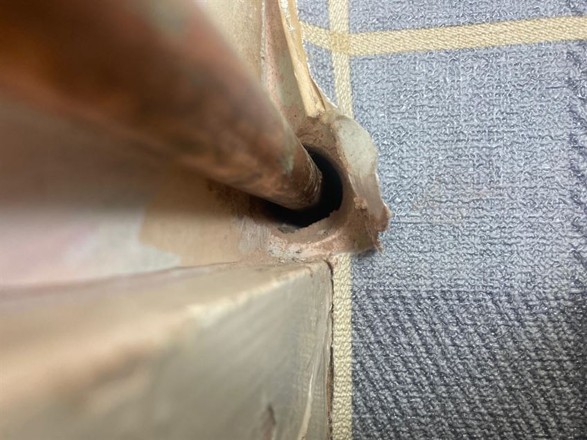 Close-up of unsleeved gas supply pipe at a Stevenage property