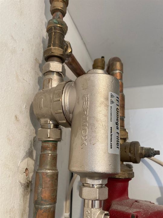 Existing magnetic filter and pipework before the heating system upgrade in St John’s Wood