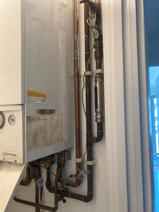 Old non-condensing Ariston boiler and pipework before replacement in Highgate