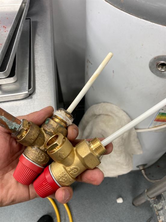 Removed scaled temperature and pressure relief valves from an unvented hot-water cylinder
