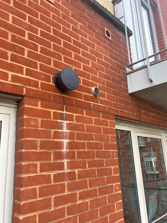 Completed exterior twin-flue terminations for the new Keston boiler in Highgate London