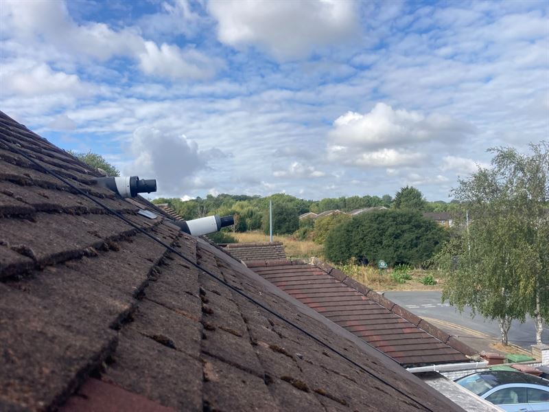 Exterior roof area and flue pipework photographed during the Borehamwood inspection