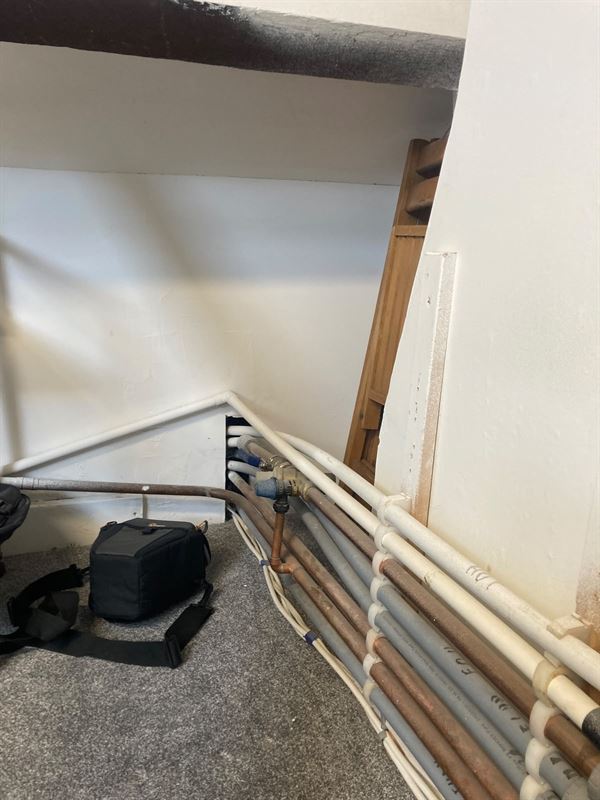 Discharge and associated pipework routed through the property