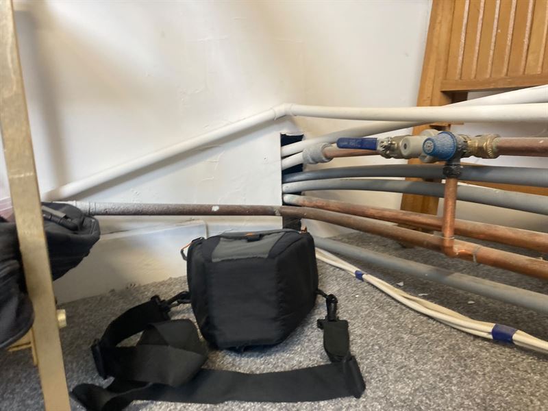Close view of the pipework route near floor level