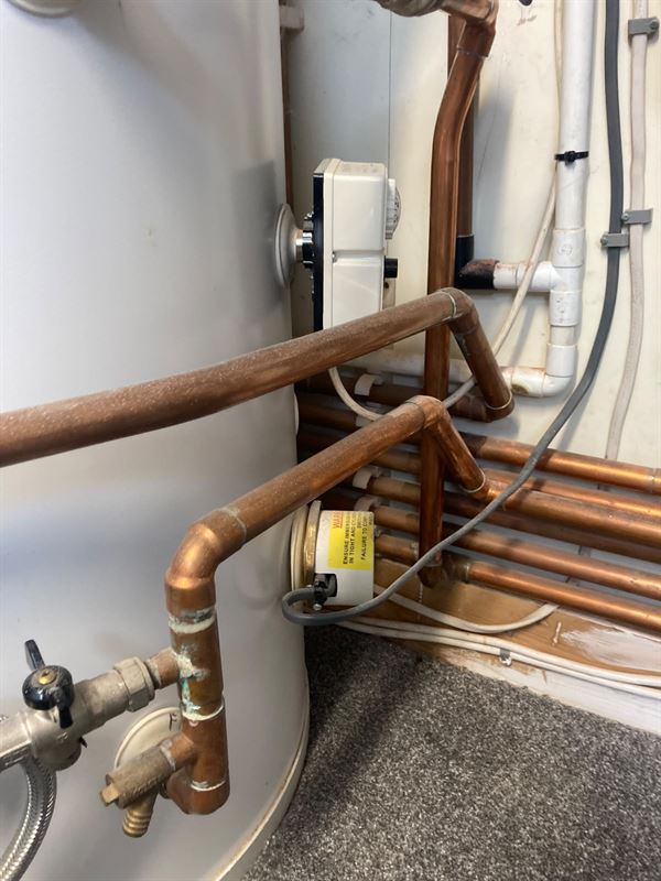 Hot-water cylinder valve and pipework arrangement photographed during inspection
