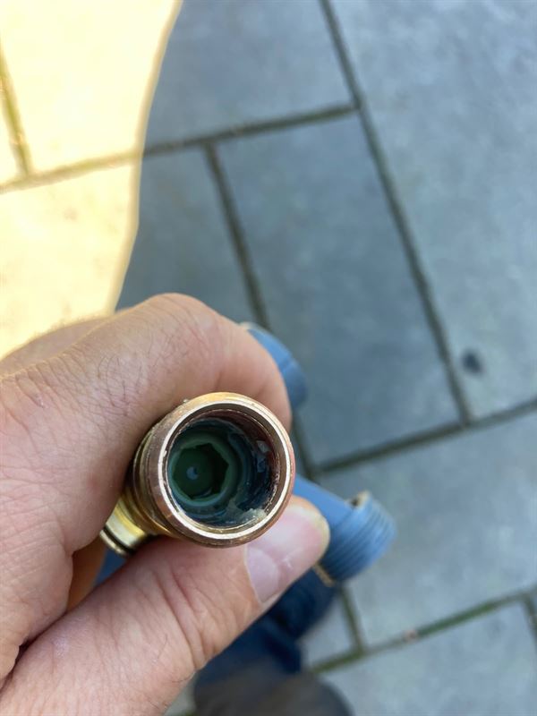 Close-up looking inside the Quooker pressure reducing valve connection