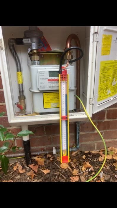 Testing equipment connected at the gas meter during final checks in Bushey