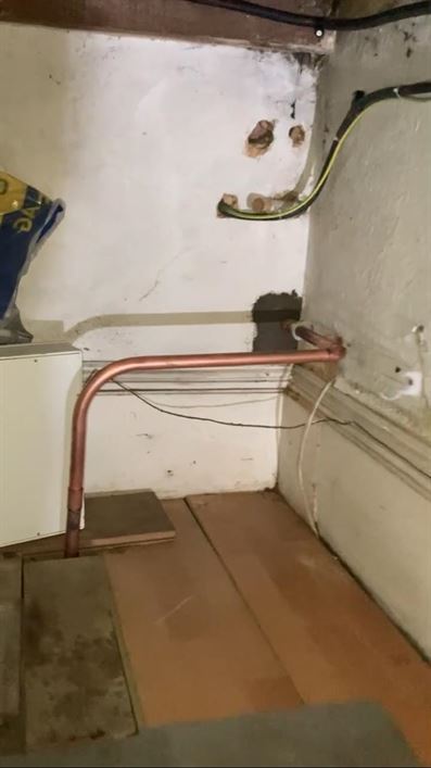 Replacement gas pipework in the staircase area of the Bushey property