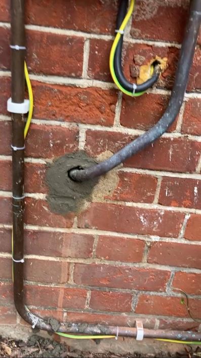 Gas pipe wall entry after making good around the penetration