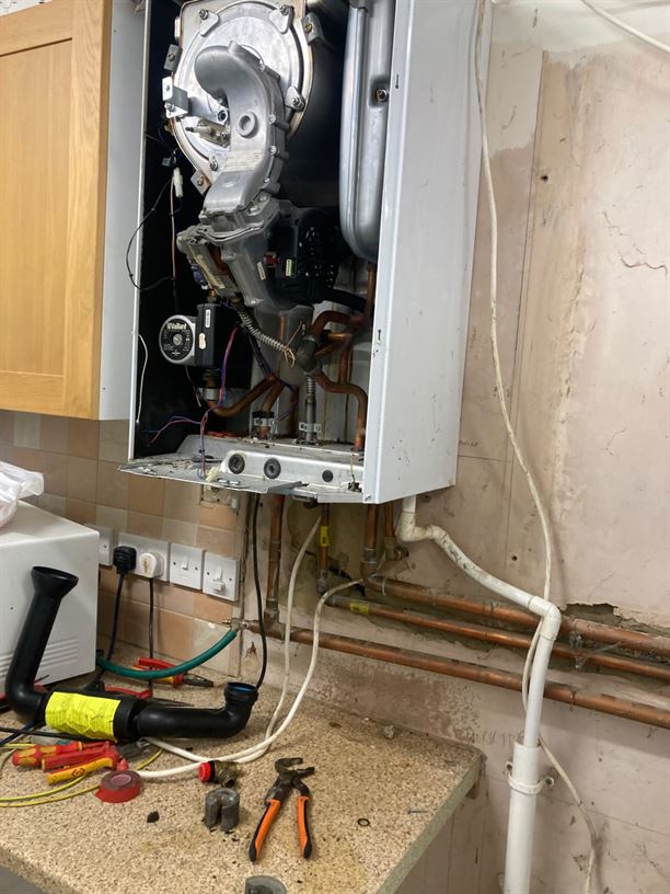 Existing Vaillant system boiler opened during replacement work in Radlett