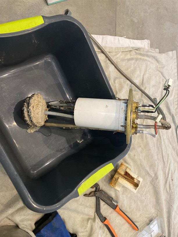 Removed Quooker internal assembly with visible limescale deposits