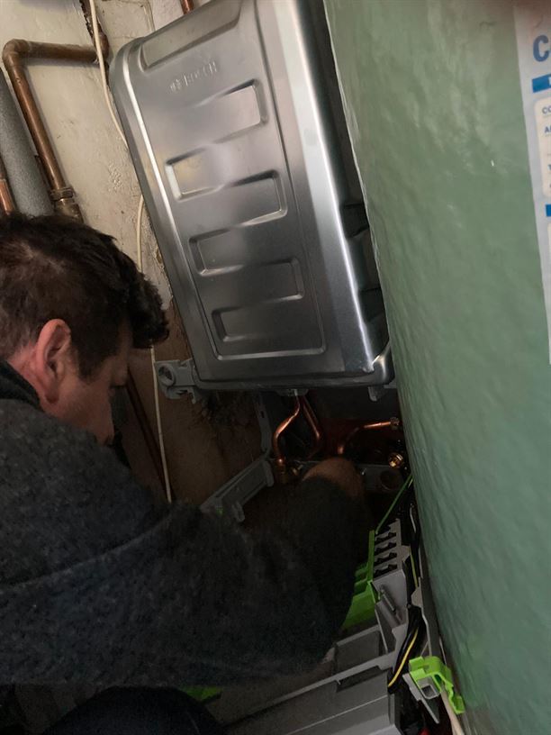 Engineer working on the new Worcester Bosch boiler installation